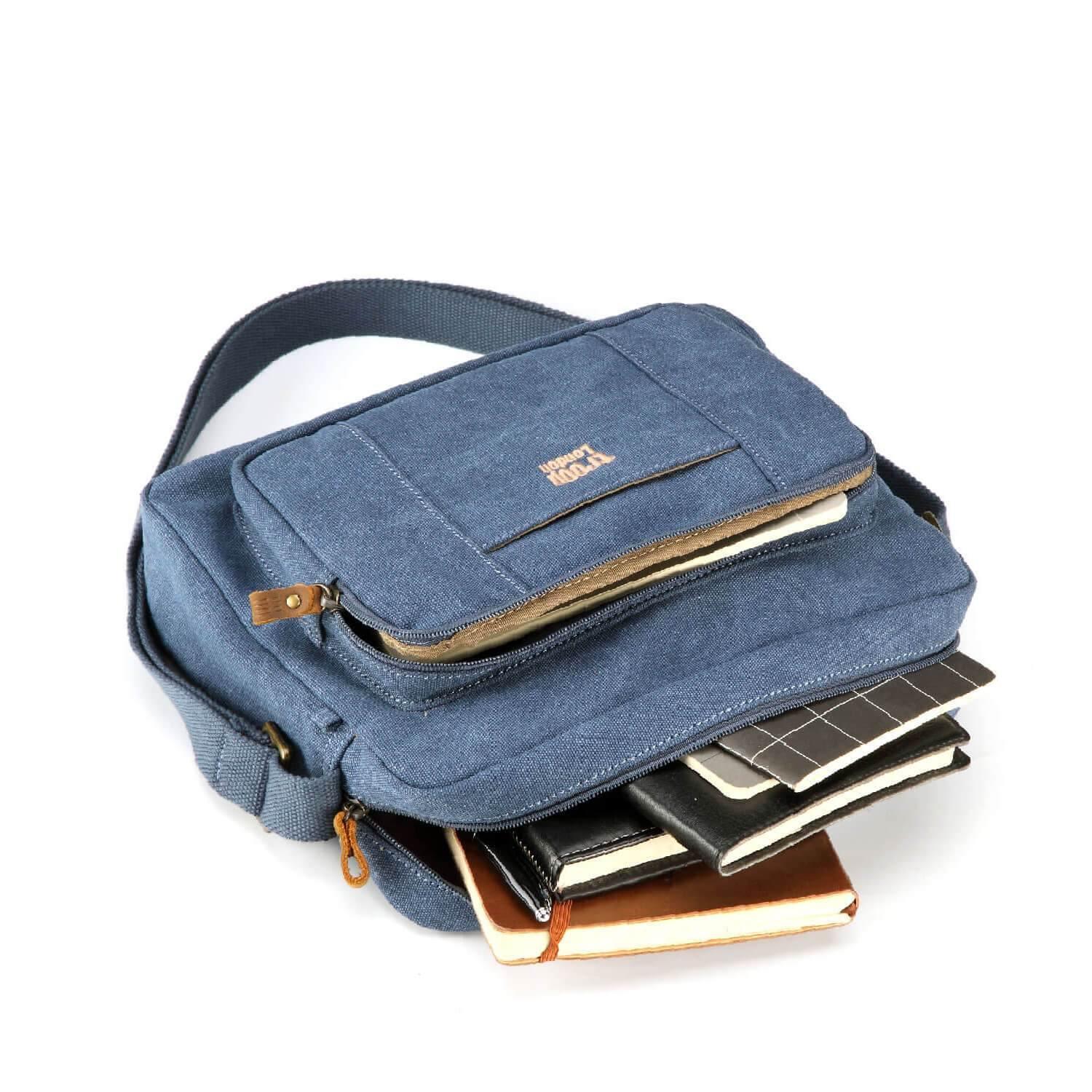 Large stonewashed canvas crossbody bag with adjustable shoulder strap and brass buckles — view 4