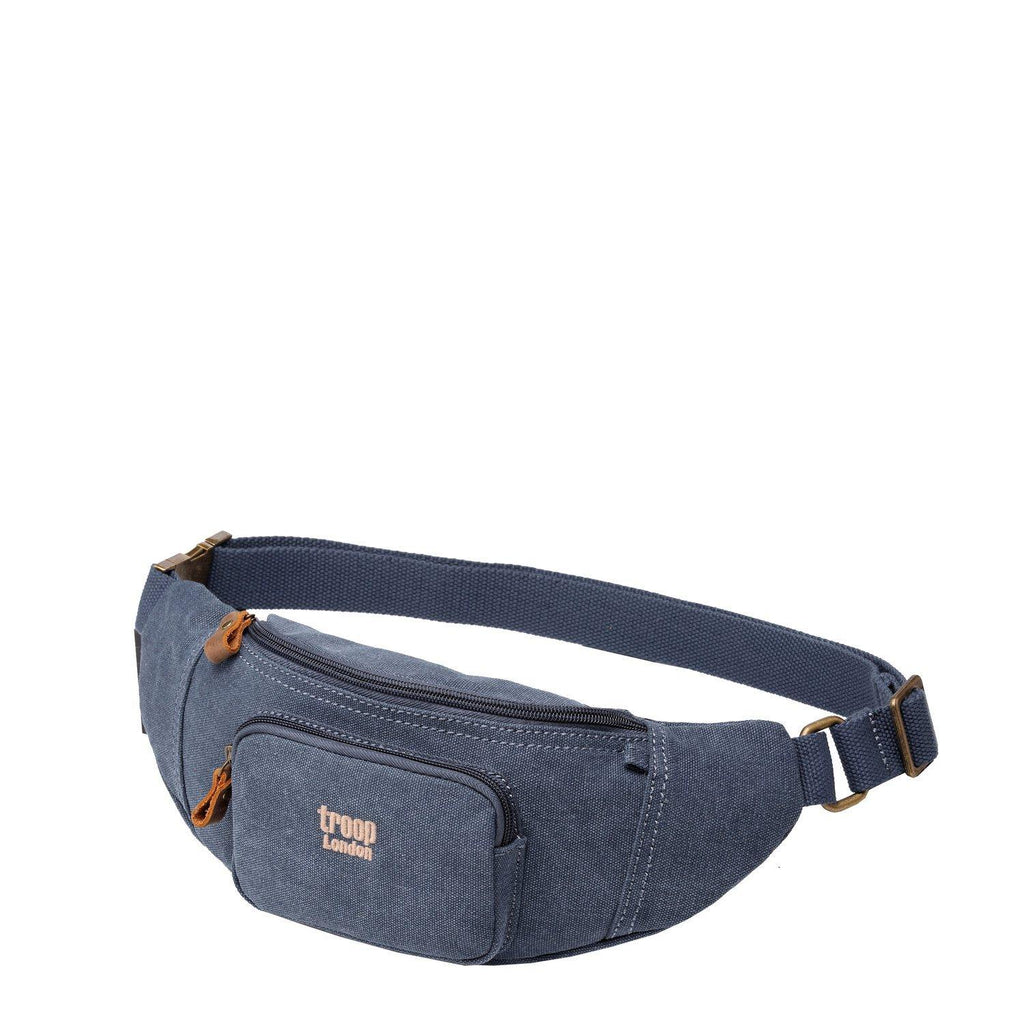 Stonewashed canvas waist bag with genuine leather trimmings, front zipper pockets, and adjustable waist strap