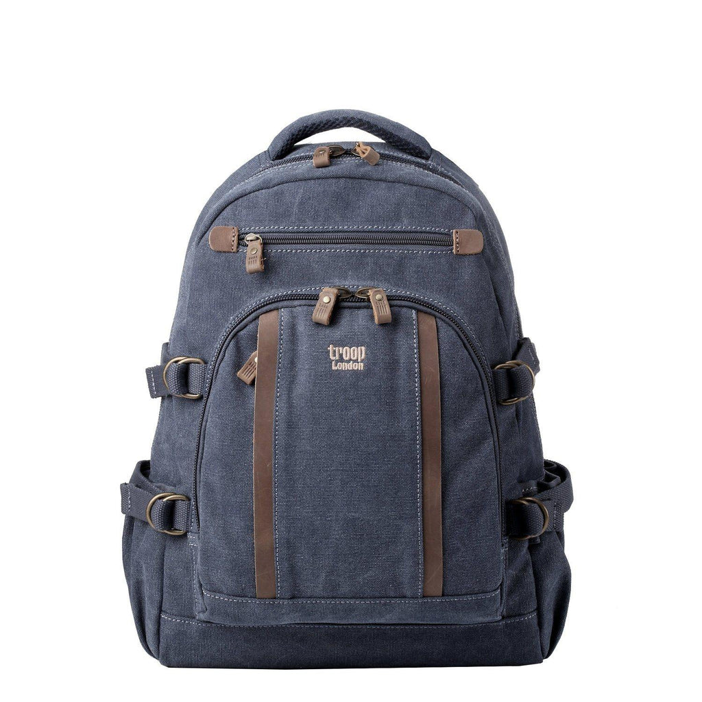 Large stonewashed canvas laptop backpack with leather trimmings, brass hardware, and padded shoulder straps.