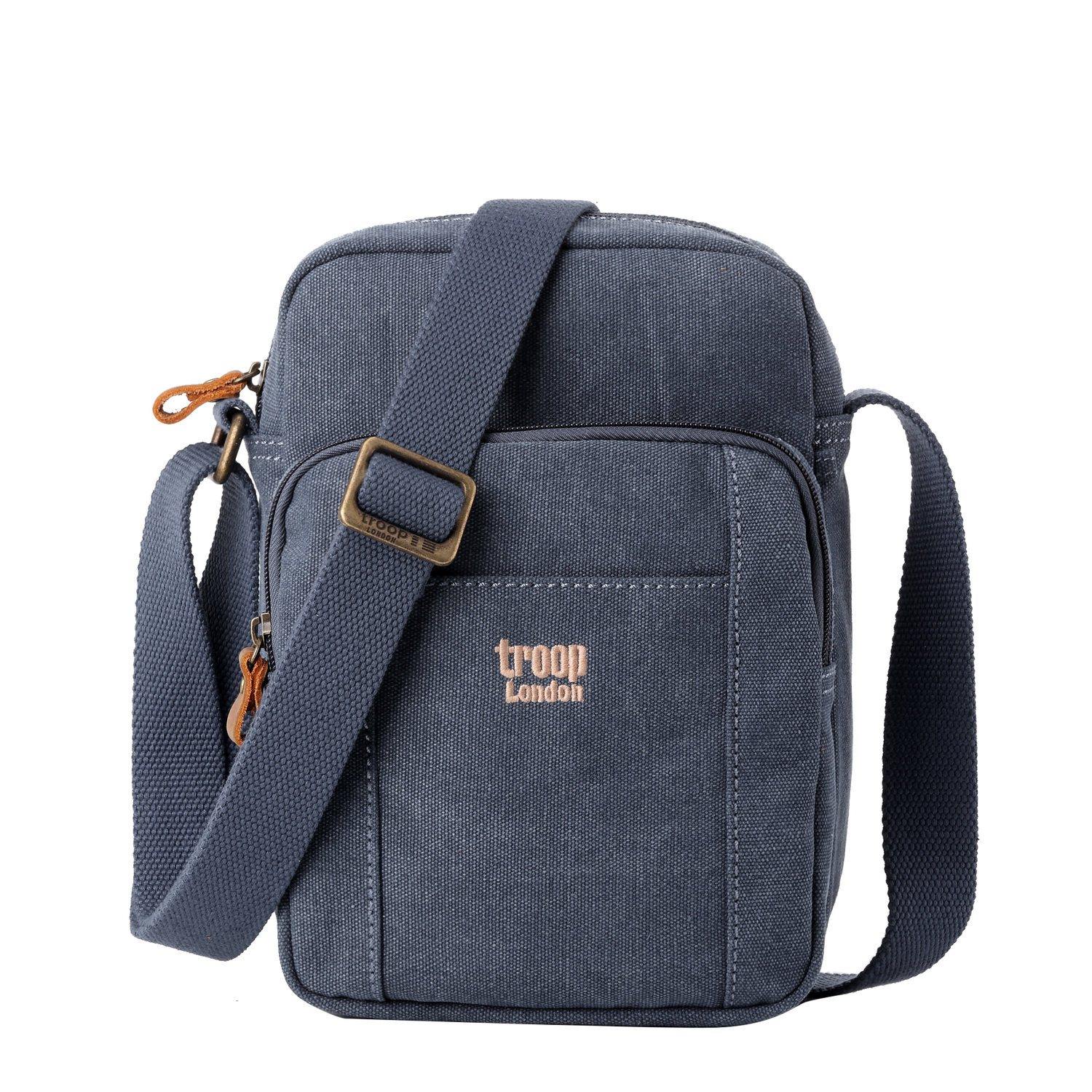 Vertical stonewashed canvas crossbody bag with genuine leather trim and an adjustable shoulder strap
