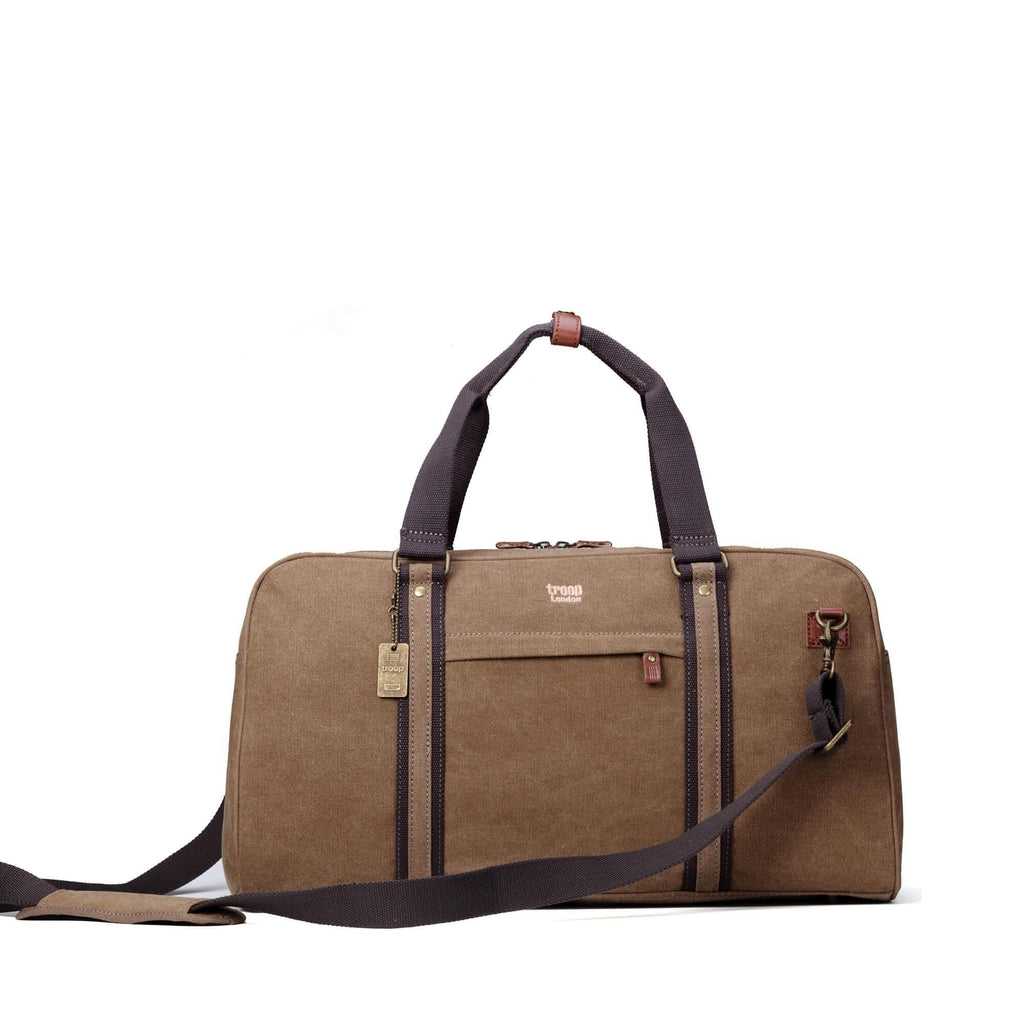 Medium stonewashed canvas travel duffel bag with genuine leather trim and brass hardware carry handles. — view 4
