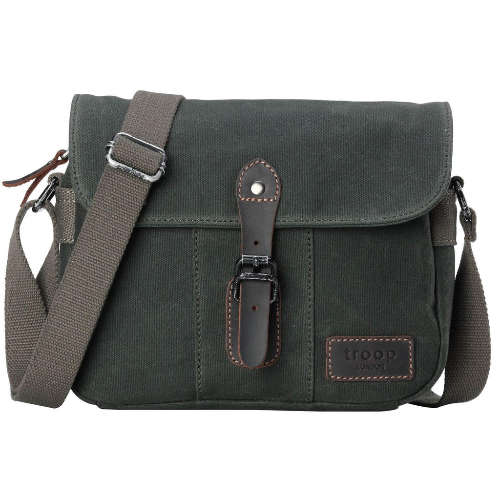 Waxed canvas crossbody bag with genuine leather trimmings, antique brass hardware, and adjustable shoulder strap