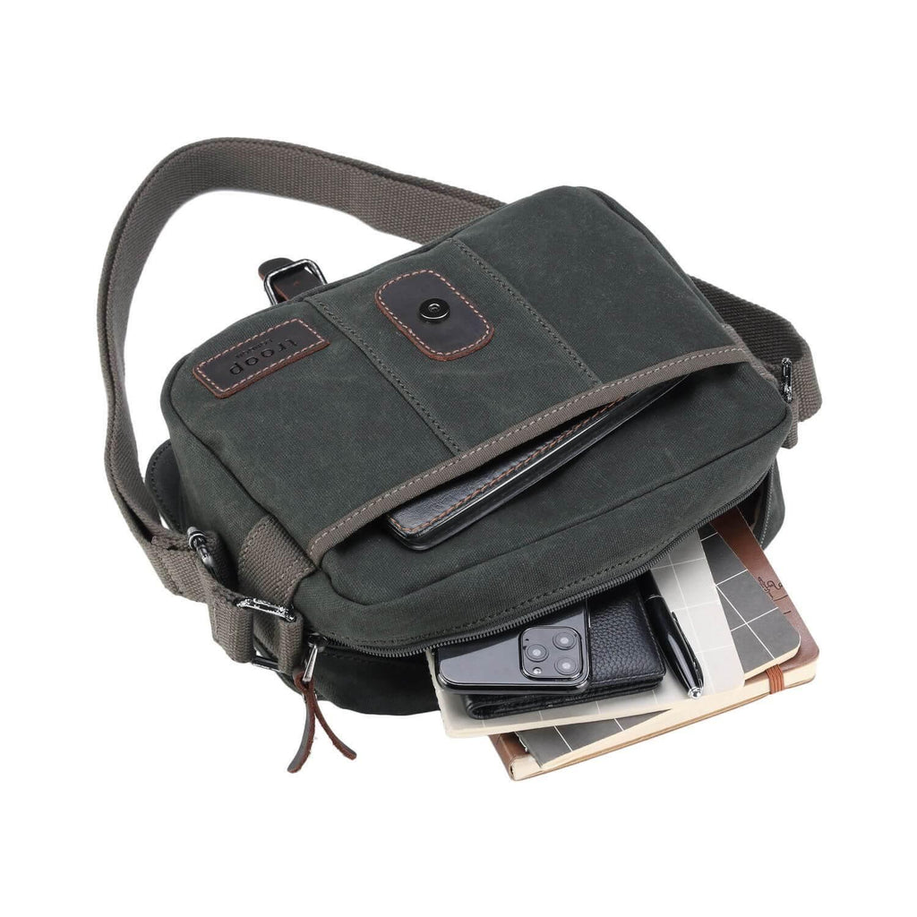 Waxed canvas crossbody bag with genuine leather trimmings, antique brass hardware, and adjustable shoulder strap — view 4