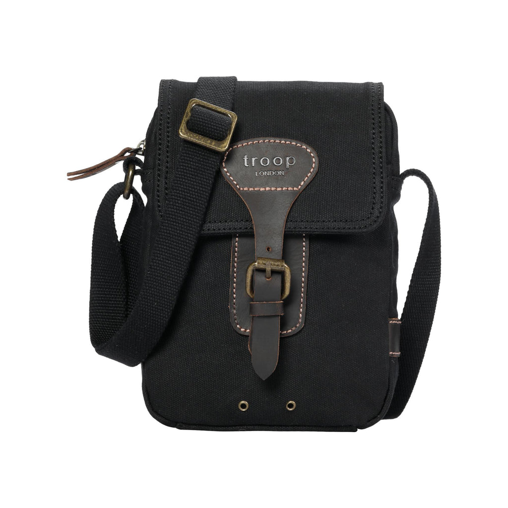 Compact waxed canvas crossbody bag with genuine leather trim and adjustable shoulder strap