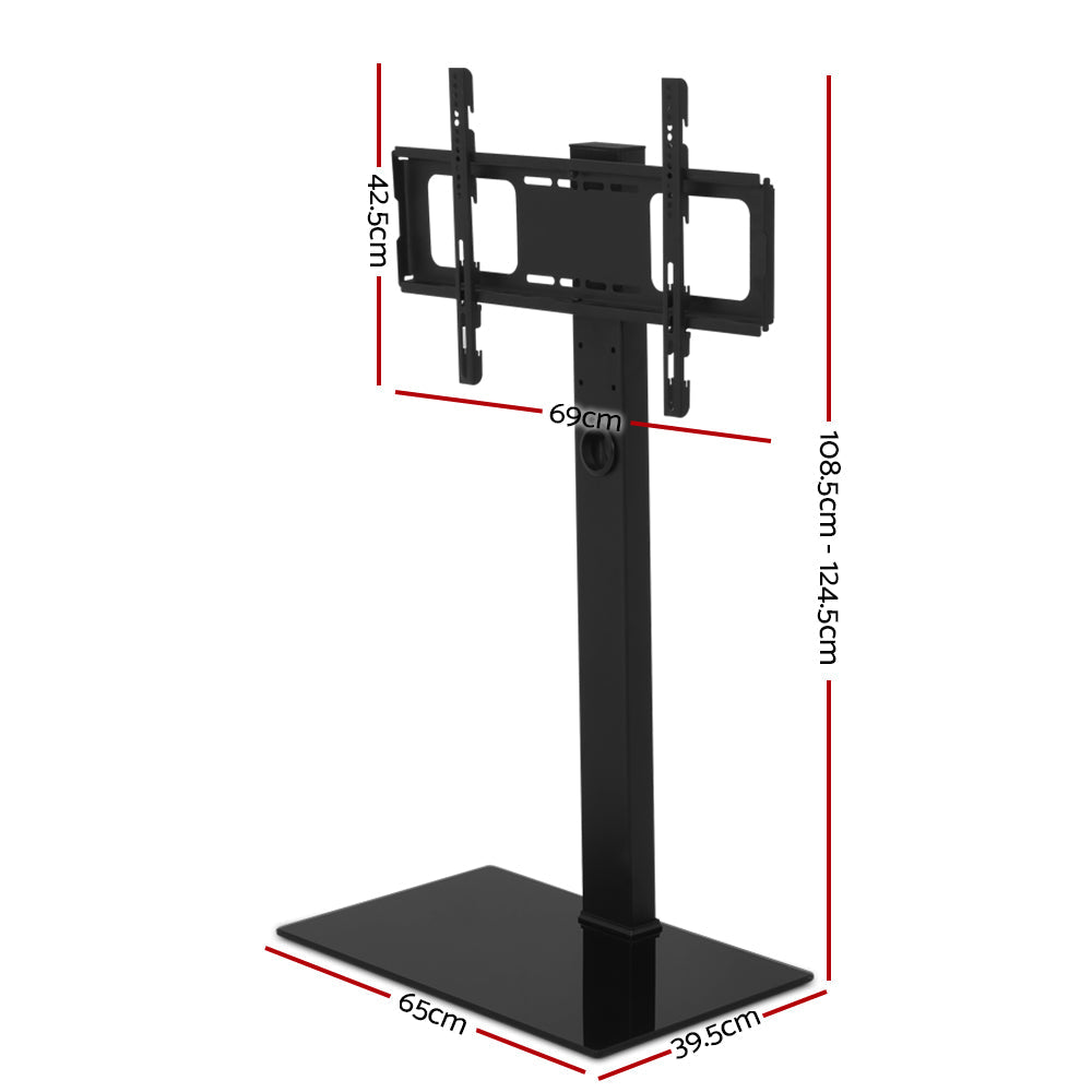 Black freestanding TV floor stand with adjustable mount bracket, storage shelf, and tempered glass base — view 4