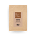 Tanzania whole bean coffee inside a brown eco-friendly kraft paper packaging pouch