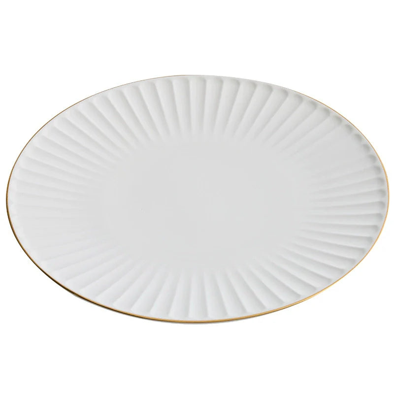White ceramic dinner plate with pleated texture and a hand-painted gold rim — view 5