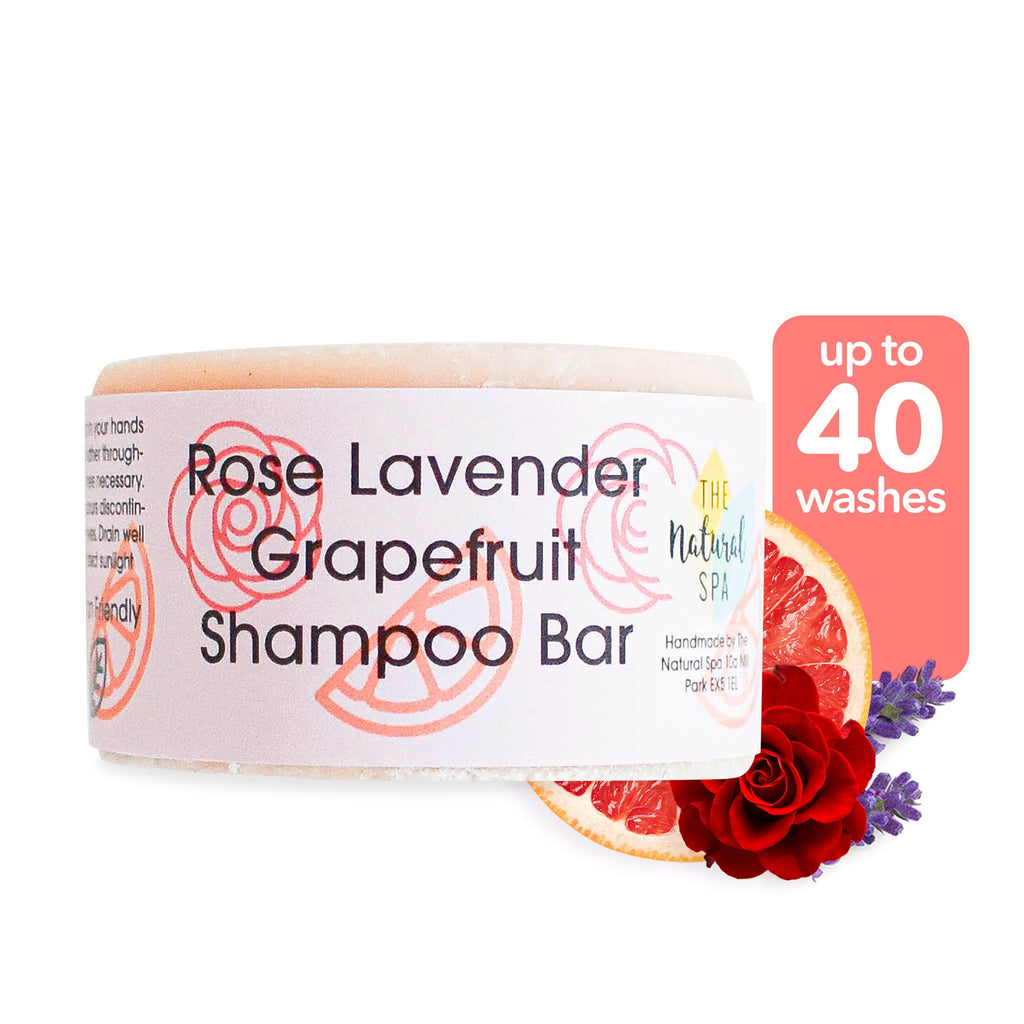 Solid rose lavender and grapefruit shampoo bar beside natural ingredients and plastic free packaging — view 3