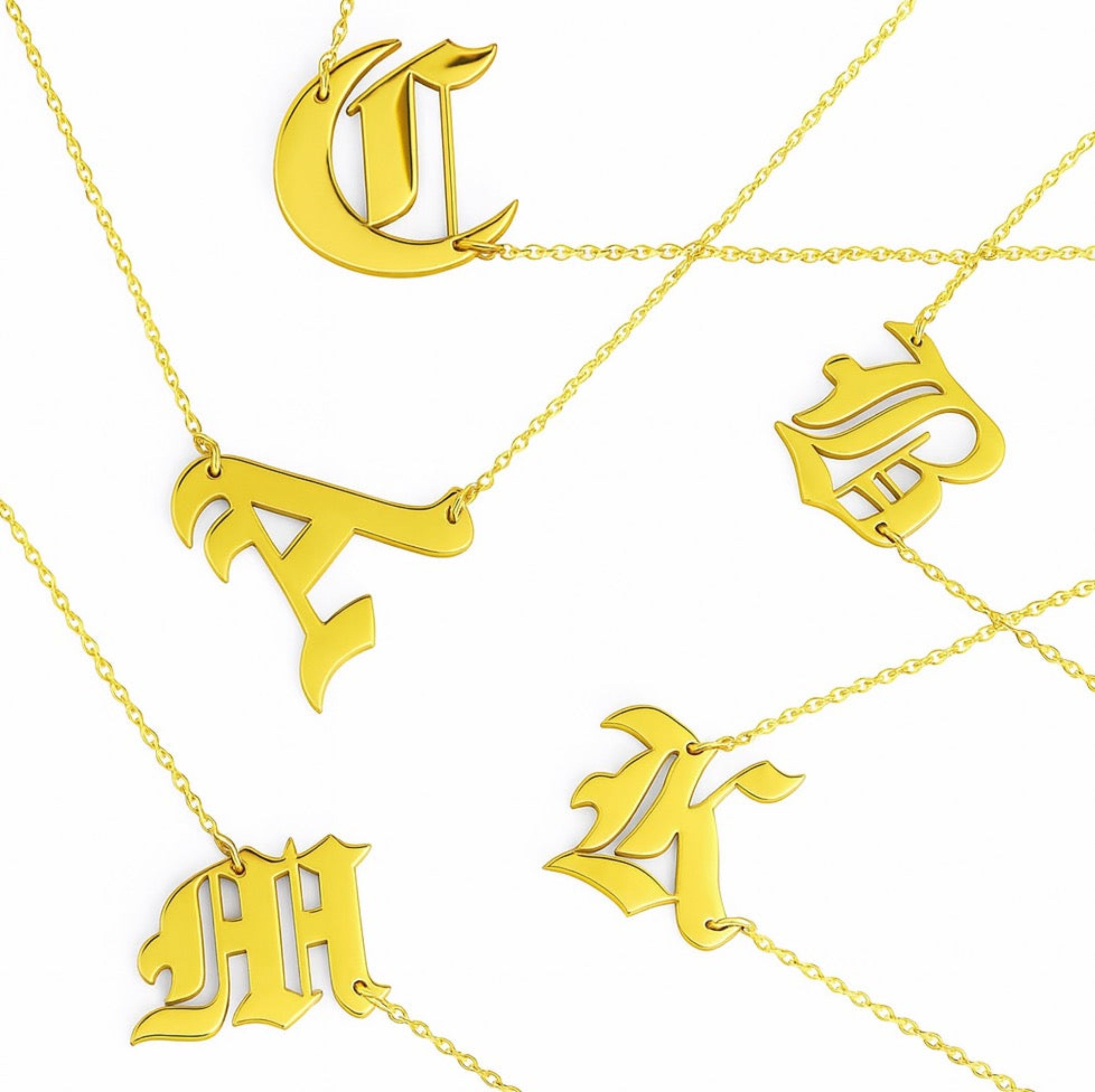 18K gold plated stainless steel gothic initial necklace hanging elegantly to the side — view 2