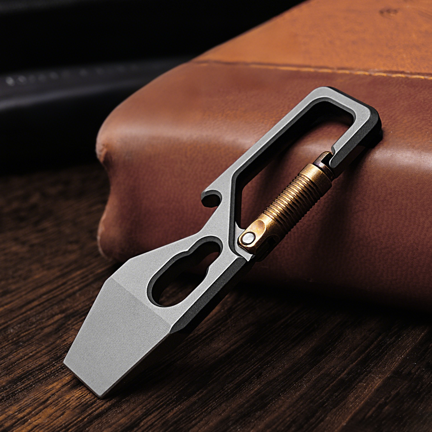 Titanium multi-tool carabiner in metallic silver, designed for outdoor camping and heavy-duty everyday carry — view 4