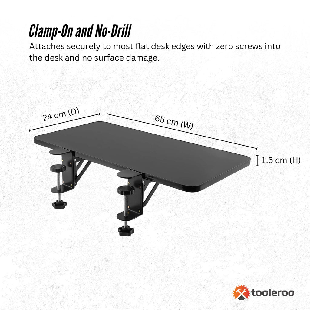 Black folding clamp-on desk extension tray with steel mounts attached to a wooden desk — view 4
