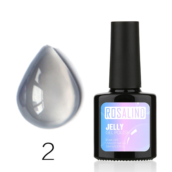 Translucent nail polish bottle and applicator brush featuring a sheer natural resin formula — view 2