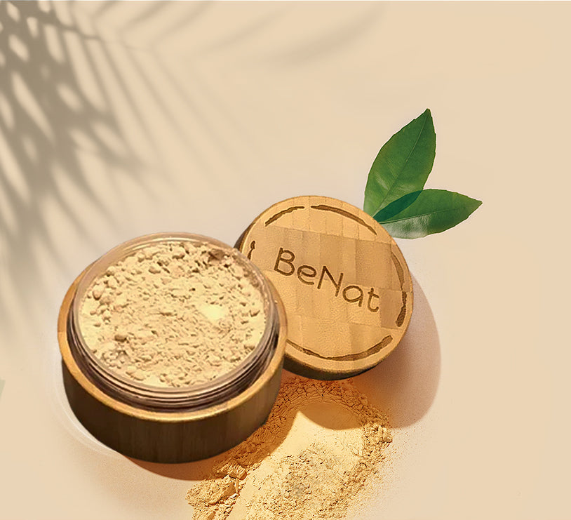 Translucent loose setting powder in an eco friendly bamboo container with puff and plastic sifter