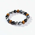 Triple protection healing bracelet featuring natural Orca Agate, Tiger's Eye, Hematite, and Black Obsidian beads