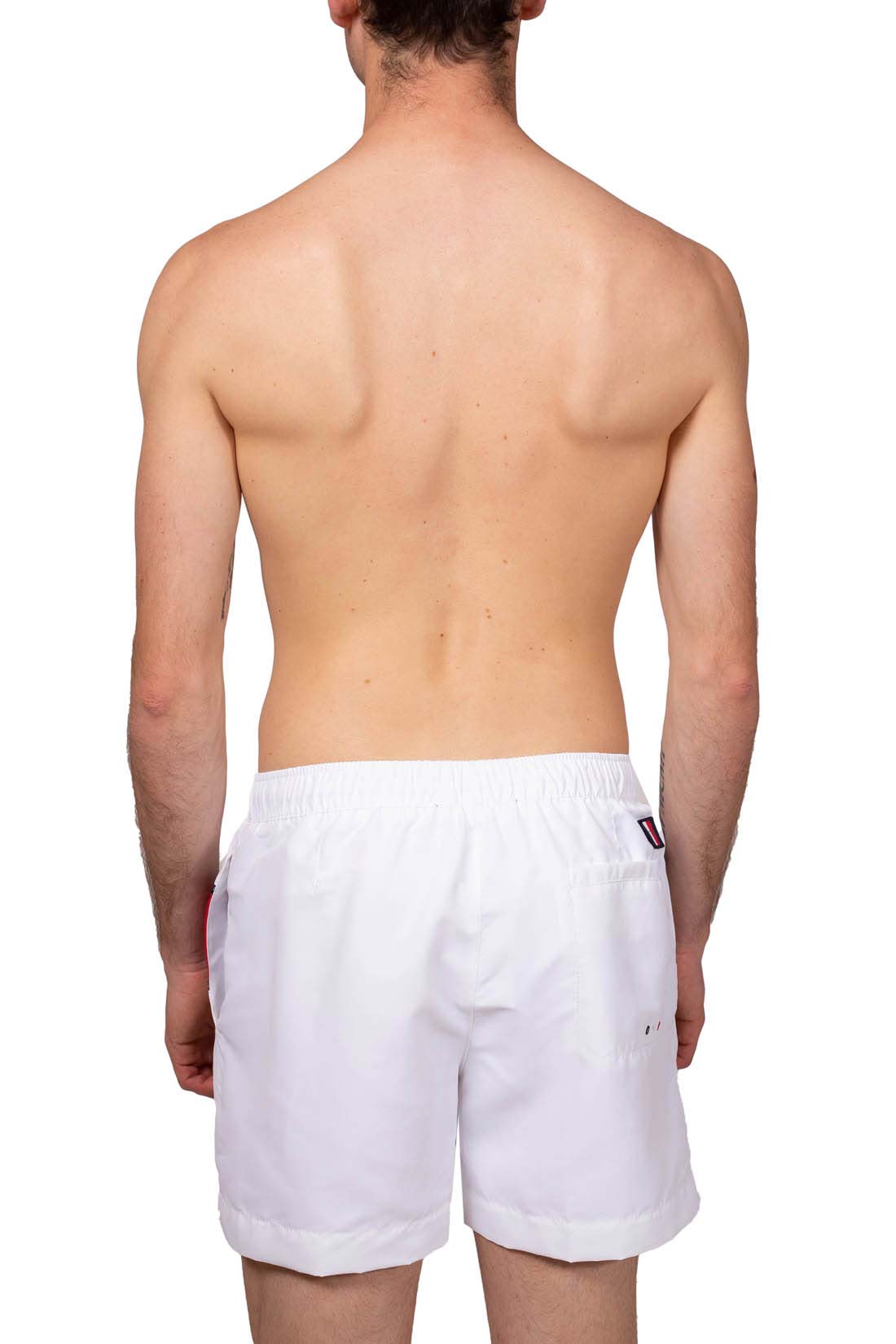 Men's white colorblock swim shorts with elastic waistband, drawstring, and signature logo taping on the front. — view 3