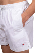 Men's white nylon swim shorts with drawstring waist and embroidered logo detail