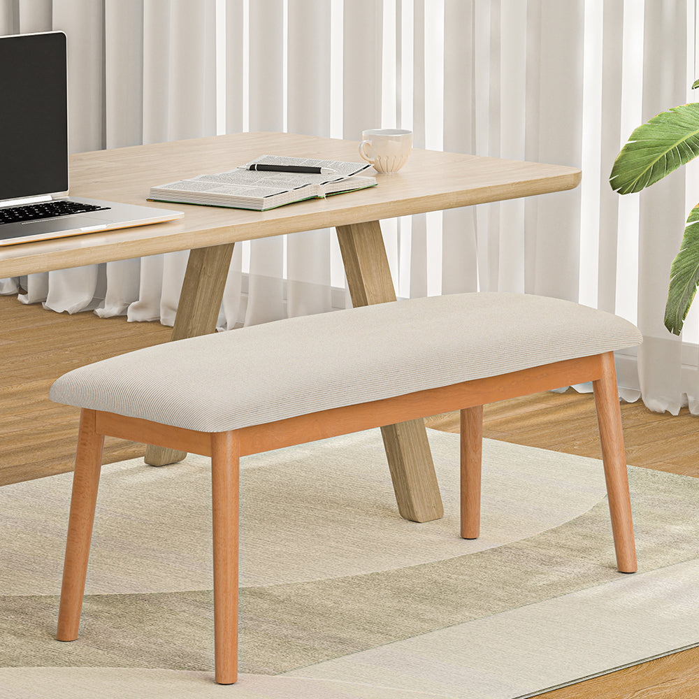 Contemporary dining bench with beige faux linen cushioned seat and solid rubberwood oak finish legs