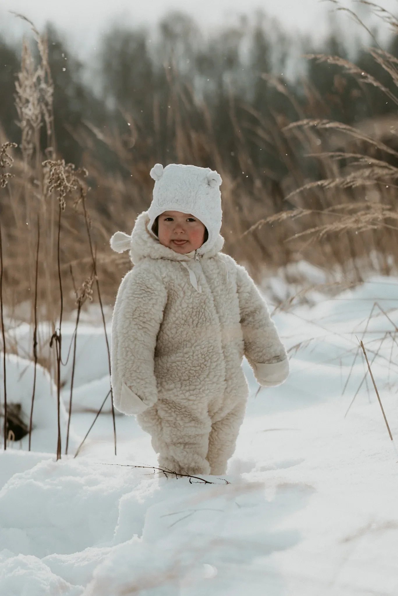 Polar white woolen baby hat with teddy texture, bear ears, and long secure tie strings — view 4