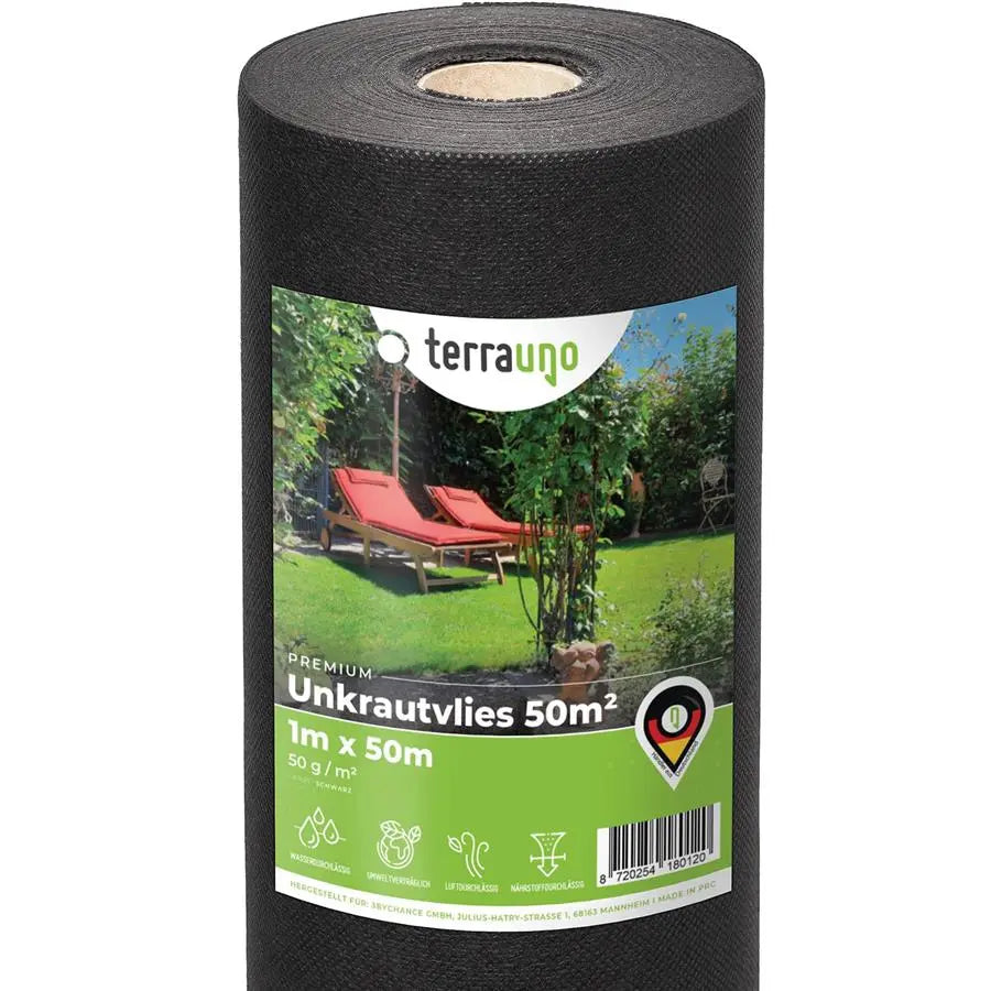 Water-permeable weed barrier fleece unrolled on a garden bed for landscaping and weed prevention. — view 4