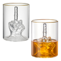 Clear 12.5 oz novelty middle finger whiskey glass sitting on a home bar counter