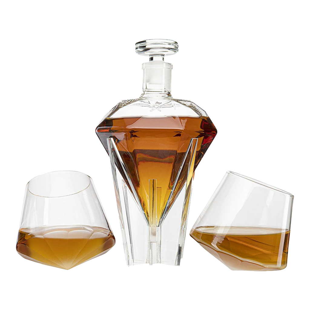 Diamond shaped glass whiskey decanter on a clear base with two matching diamond glasses.