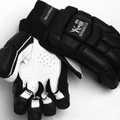 White leather cricket batting gloves with breathable mesh and padded fingers for impact protection