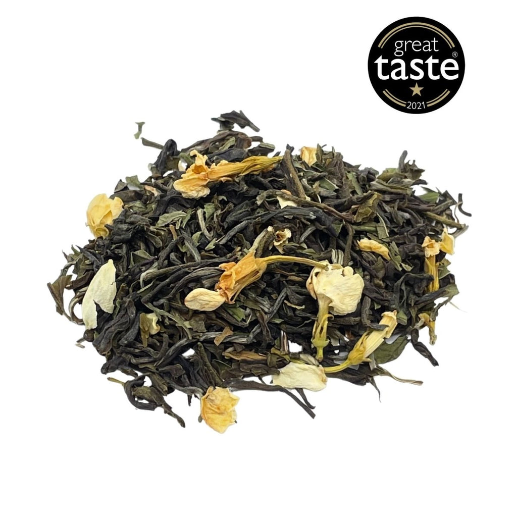 Loose leaf jasmine and mint green tea blend showing premium leaves peppermint and delicate blossoms