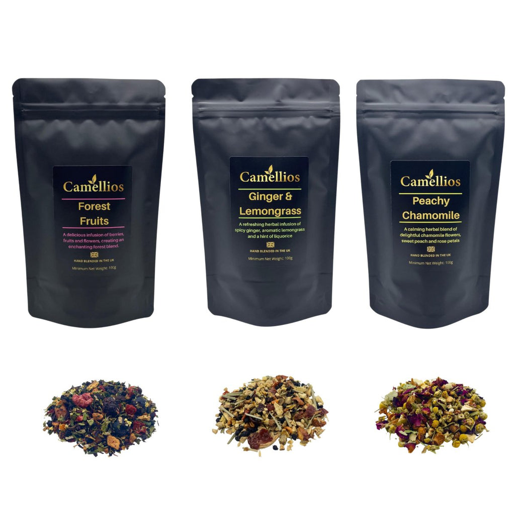 Three pouches of premium herbal loose leaf tea blends surrounded by natural fruits and flowers