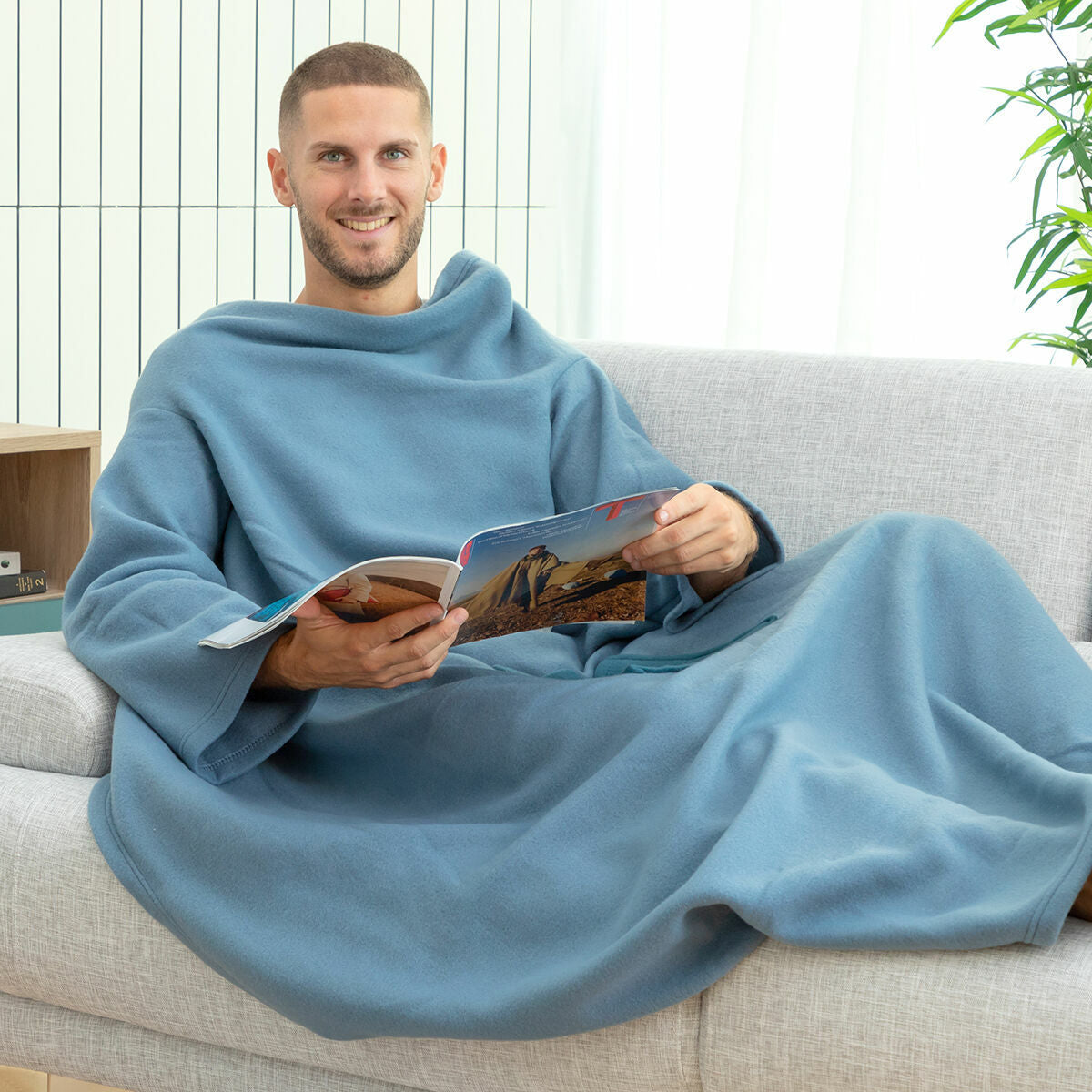 Soft wearable single sleeved blanket with a large central pocket for cozy winter lounging — view 4