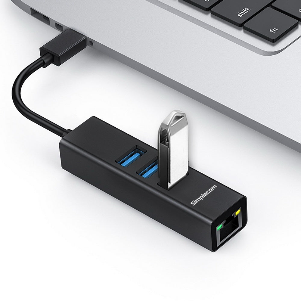 Black aluminium USB-C hub with three USB ports and Gigabit Ethernet adapter on white background — view 3