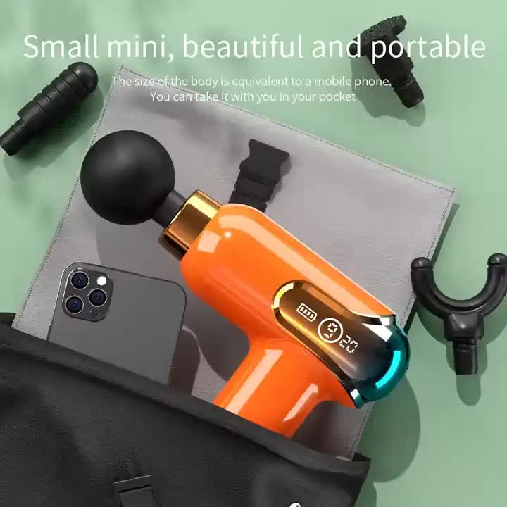 Orange portable deep tissue massage gun with four interchangeable heads and digital speed display — view 3
