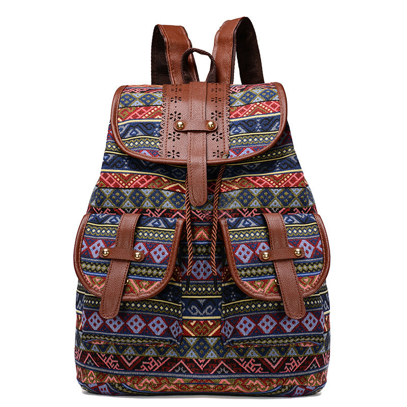Bohemian canvas backpack featuring a colorful vintage tribal diamond pattern and faux leather straps