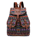 Bohemian canvas backpack featuring a colorful vintage tribal diamond pattern and faux leather straps