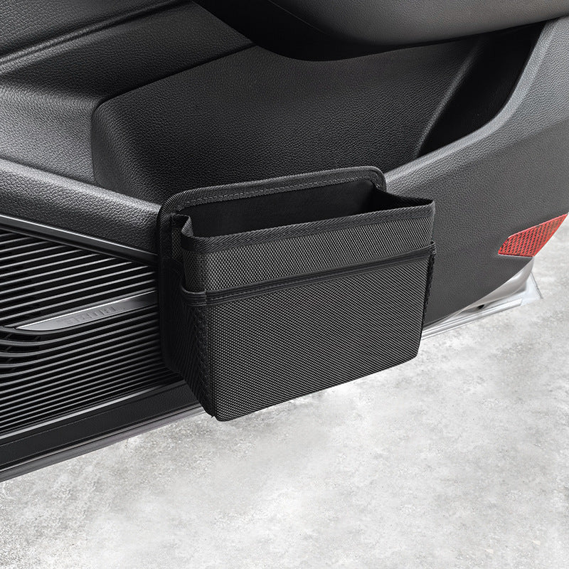 Grey waterproof hanging car storage bag and back seat organizer attached to a car seat. — view 2