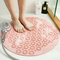 Pink round silicone foot scrubber mat with soft massage bristles for shower floors and bathtubs