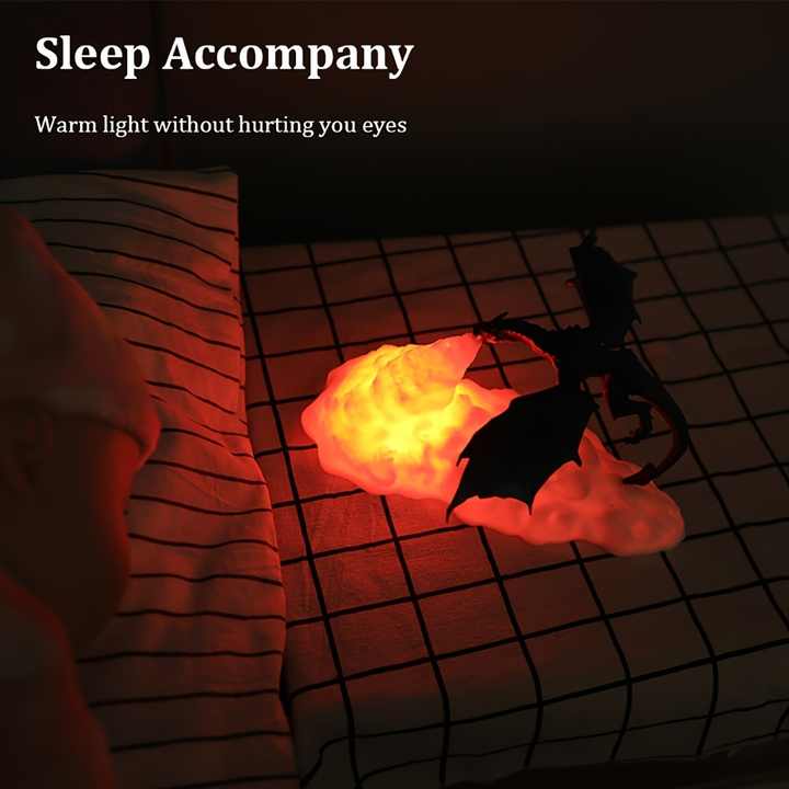 3D printed LED dragon night light breathing glowing fire on a dark bedroom desk — view 2