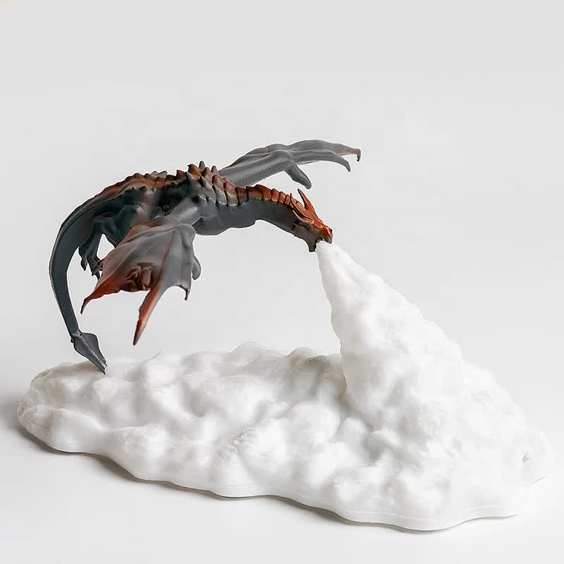 3D printed LED dragon night light breathing glowing fire on a dark bedroom desk — view 3