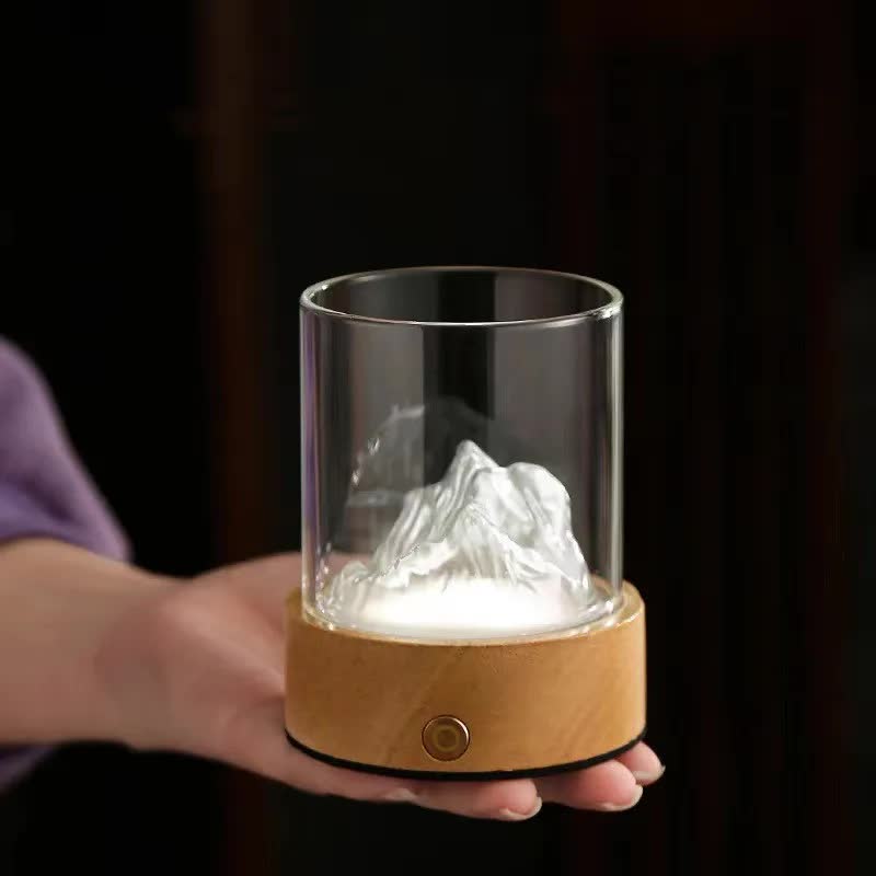 Blue-green glass mountain ambient night light with a solid wood base and clear dome cover — view 3