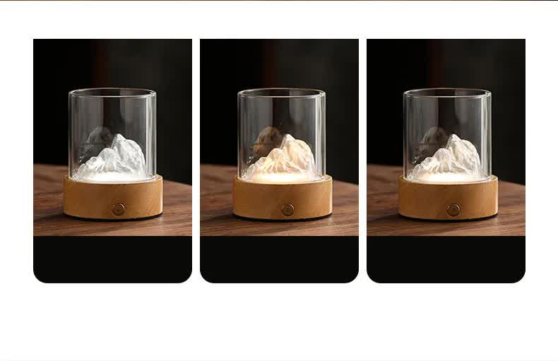 Blue-green glass mountain ambient night light with a solid wood base and glowing warm illumination — view 5