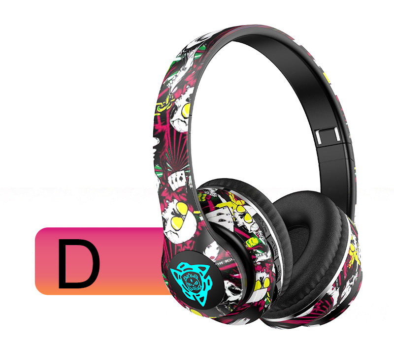 Wireless over-ear Bluetooth headphones featuring a vibrant graffiti pattern and soft comfortable ear cushions