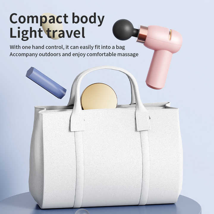 Purple portable mini massage gun with compact ergonomic design for deep tissue muscle relaxation and recovery — view 2