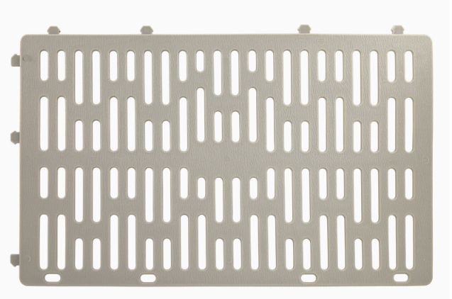 Grey plastic tree guard protector roll with perforated ventilation slots for garden plant protection.