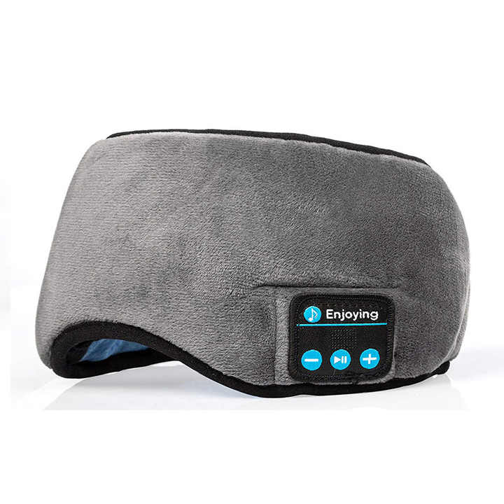 Grey wireless Bluetooth sleep mask with plush fabric cover and built in audio speakers