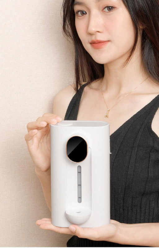 White smart automatic mouthwash dispenser with magnetic cups attached, mounted on a bathroom wall. — view 2