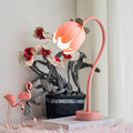 Pink LED tulip desk lamp featuring a flexible gooseneck and sturdy metal base for reading