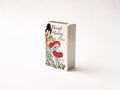 Glazed ceramic book-shaped vase and desk organizer featuring colorful botanical cover illustrations