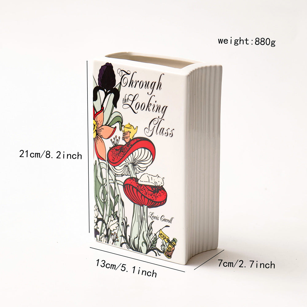 Glazed ceramic book-shaped vase and desk organizer featuring colorful botanical cover illustrations — view 3