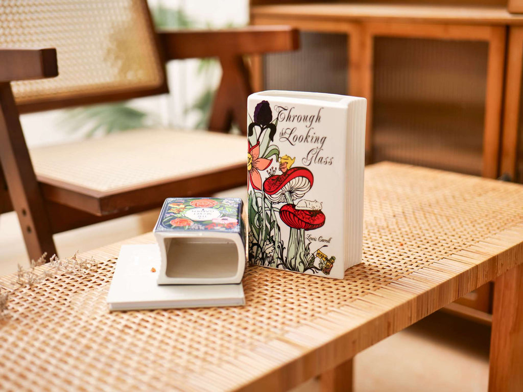 Glazed ceramic book-shaped vase and desk organizer featuring colorful botanical cover illustrations — view 5