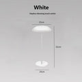 White minimalist rechargeable LED touch table lamp with metal mushroom shade and slim stem