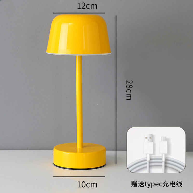 Yellow modern minimalist LED table lamp with touch control base and cordless rechargeable design